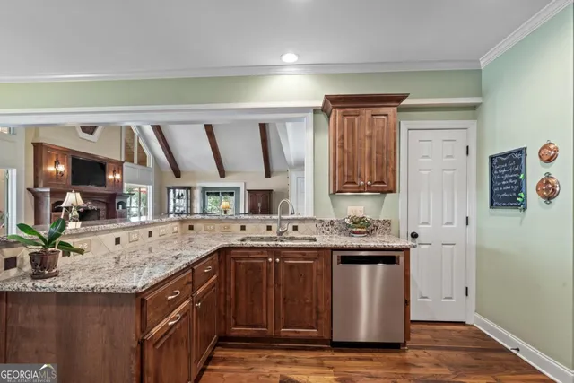 a spacious bathroom with a double vanity sink a large mirror and shower