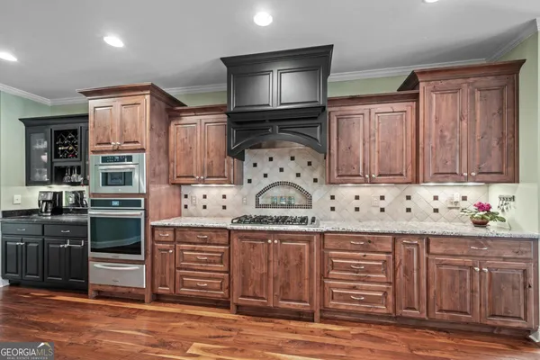 a bedroom with a bed and a dresser in it