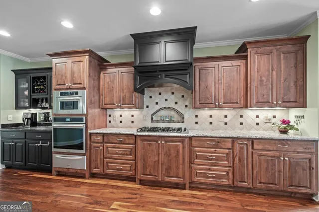 a bedroom with a bed and a dresser in it