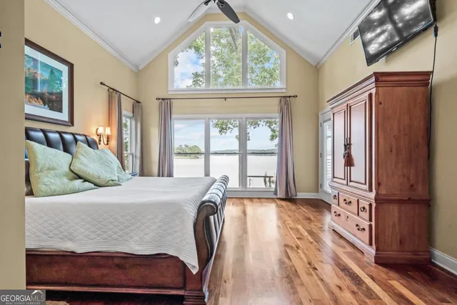 a spacious bathroom with a granite countertop sink a toilet and a mirror