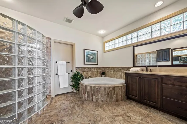 a view of front door with wooden floor and stairs