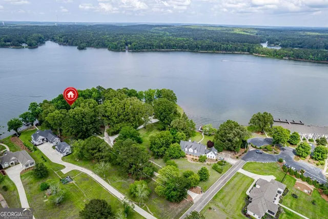 a view of a house with backyard sitting area and wooden floor