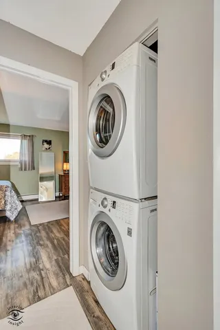 a view of a hallway with washer and dryer
