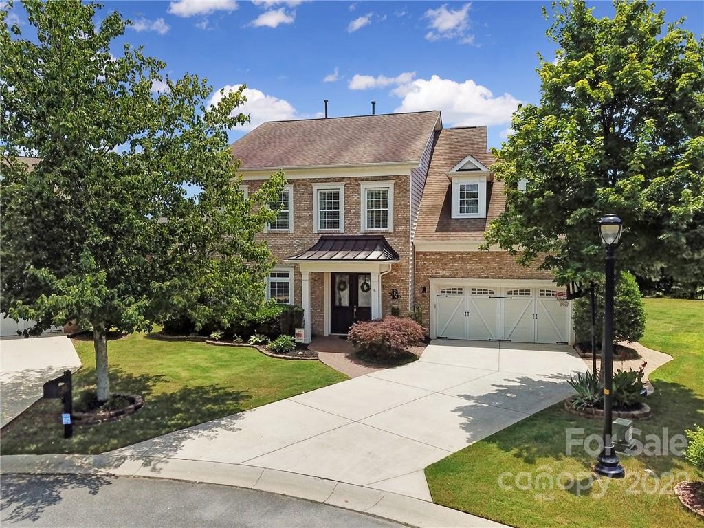 1429 Secret Path Drive Fort Mill, SC 29708 - Photo 1 of 42 a front view of a house with a yard