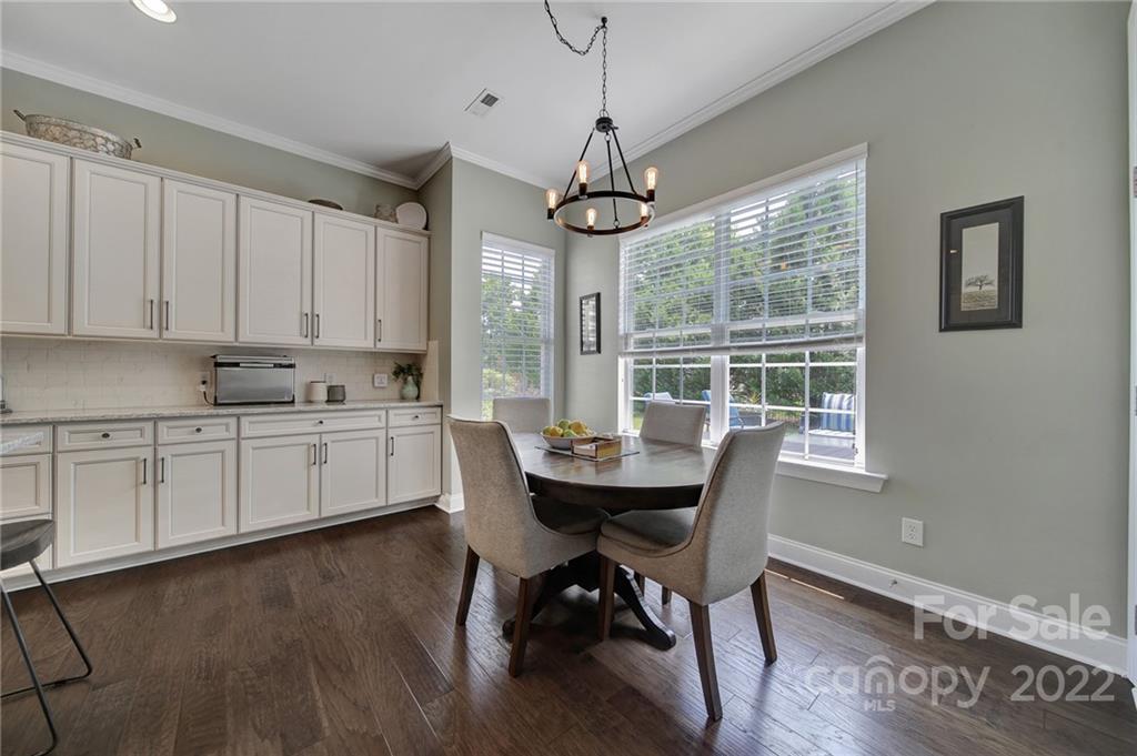 1429 Secret Path Drive Fort Mill, SC 29708 - Photo 13 of 42 a view of a dining room with furniture window and wooden floor
