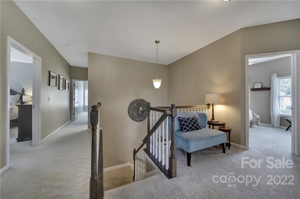 1429 Secret Path Drive Fort Mill, SC 29708 - Photo 20 of 42 a living room with furniture and a chandelier