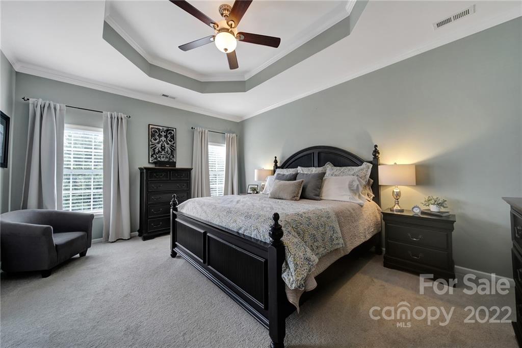 1429 Secret Path Drive Fort Mill, SC 29708 - Photo 21 of 42 a bedroom with a bed and a couch