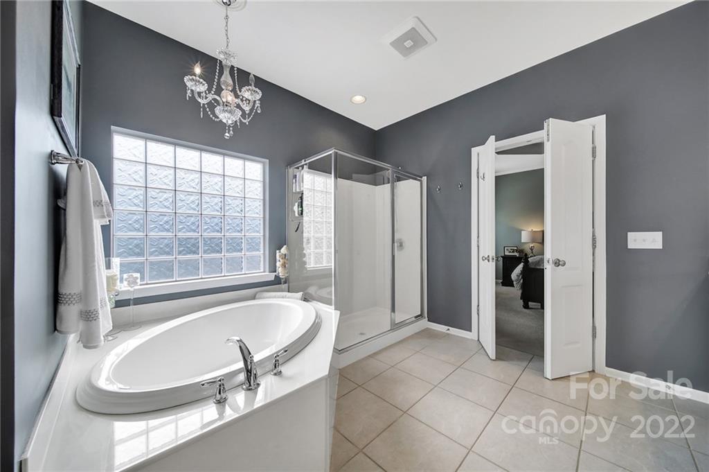1429 Secret Path Drive Fort Mill, SC 29708 - Photo 25 of 42 a spacious bathroom with a bathtub and a shower