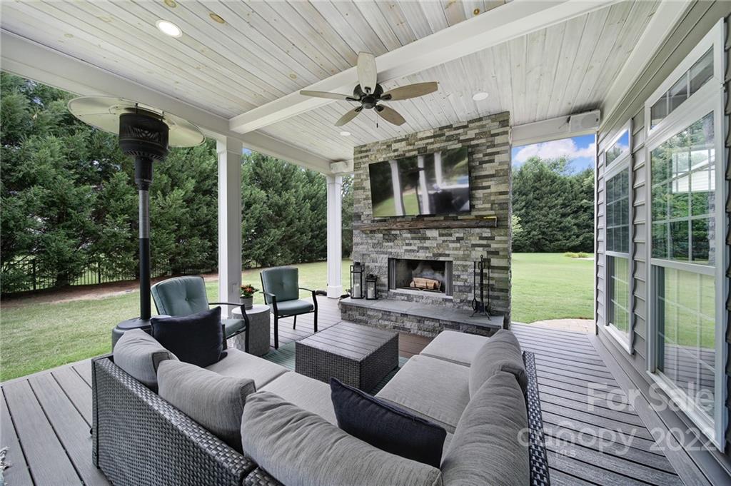 1429 Secret Path Drive Fort Mill, SC 29708 - Photo 35 of 42 a view of a patio with couches fire pit and a yard
