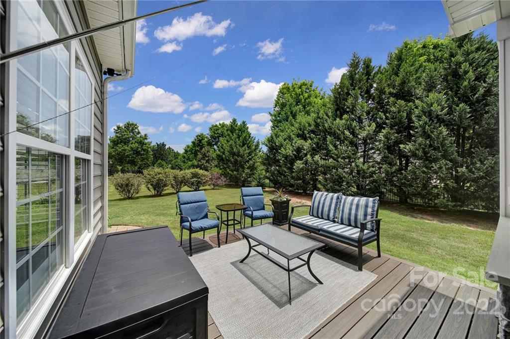 1429 Secret Path Drive Fort Mill, SC 29708 - Photo 39 of 42 a view of a chair and tables in the back yard of the house