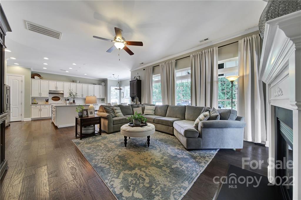 1429 Secret Path Drive Fort Mill, SC 29708 - Photo 10 of 42 a living room with furniture wooden floor and a fireplace