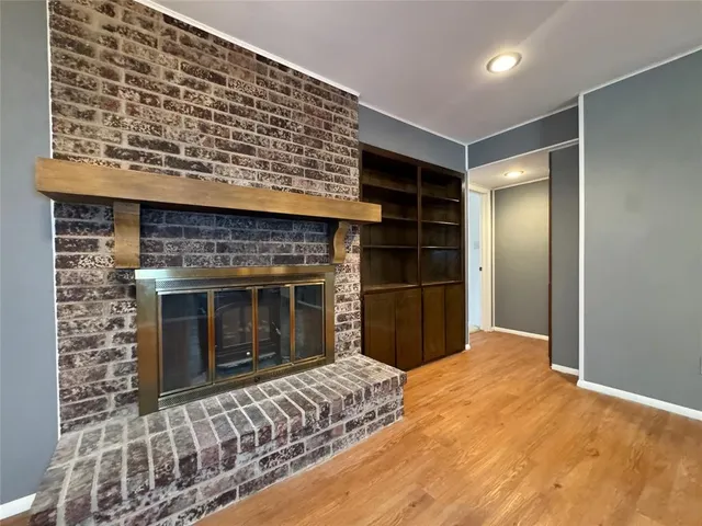 a bedroom with a bed and a fireplace