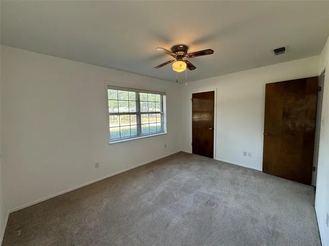 a view of empty room with windows
