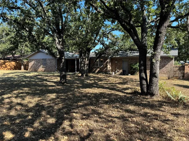 a view of outdoor space with deck and tree