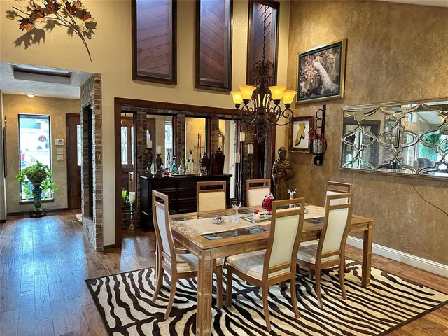 a room with a large window and furniture