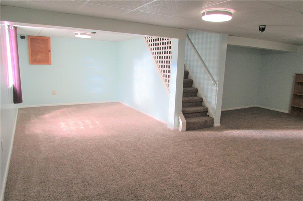 668 Kelso Road Mt. Lebanon, PA 15243 - Photo 15 of 25 Spacious lower level family room with newer beige carpeting. Walk out to the rear yard. Full bath is adjacent to this room.