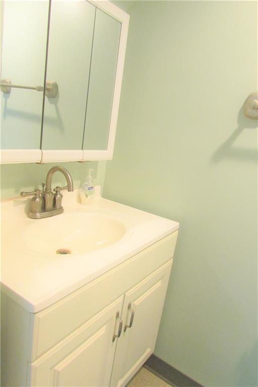 668 Kelso Road Mt. Lebanon, PA 15243 - Photo 19 of 25 Lower level full bathroom with nice white vanity, mirror and commode.
