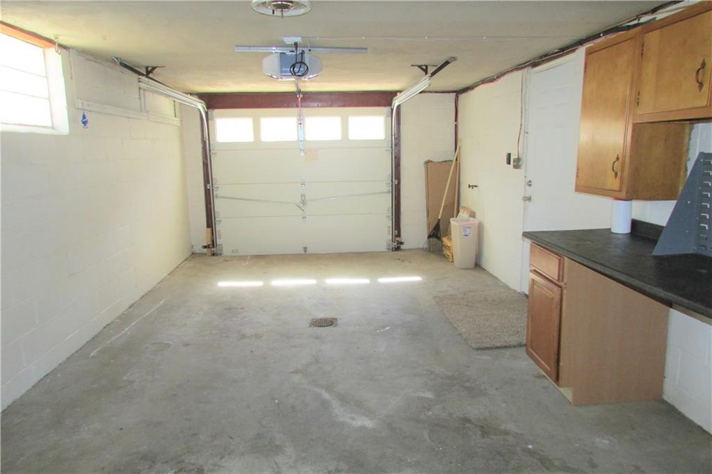 668 Kelso Road Mt. Lebanon, PA 15243 - Photo 23 of 25 Oversized garage with drain and faucet located inside. Newer garage door with auto door opener and keypad located outside. Plenty of room for the workbench and garden tool storage.