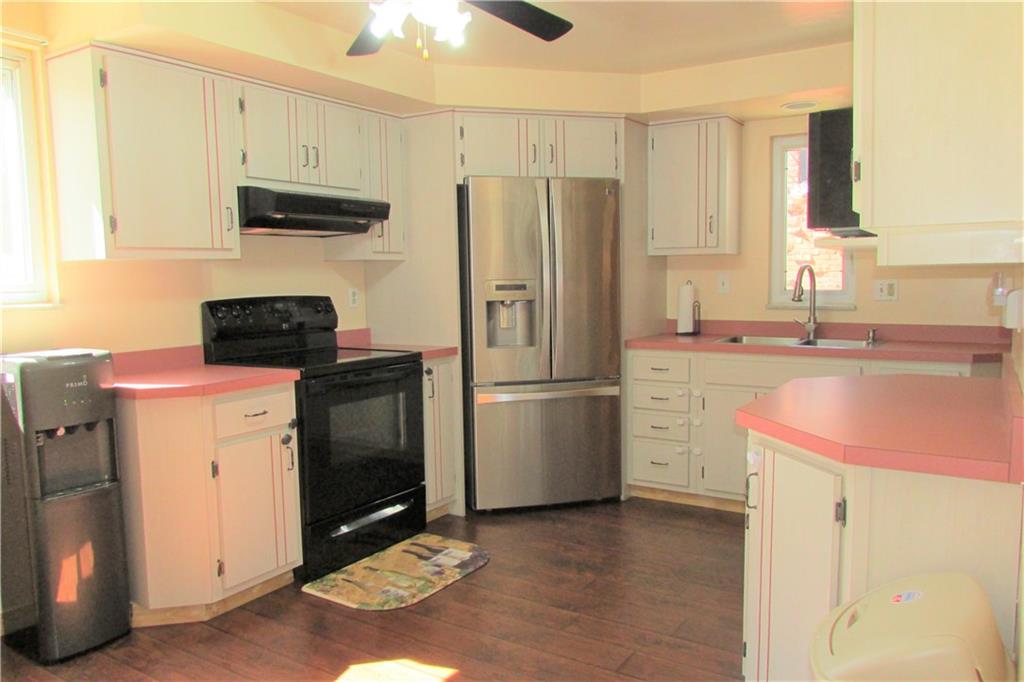 668 Kelso Road Mt. Lebanon, PA 15243 - Photo 5 of 25 Large eat-in-kitchen with newer flooring, appliances, sink and faucet! Ceiling fan helps to keep cool in the summer.