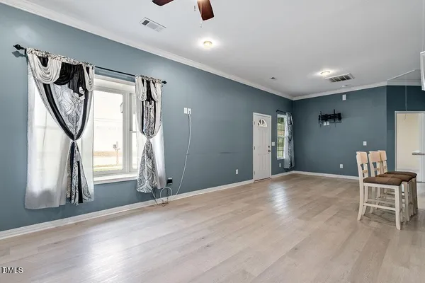 a view of livingroom with furniture and wooden floor