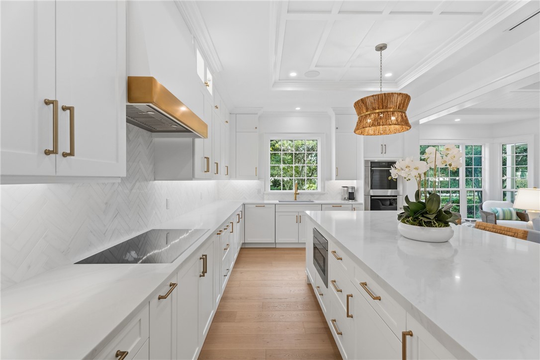 1070 Beach Road, Unit 1070 Vero Beach, FL 32963 - Photo 13 of 36 a large white kitchen with a large window
