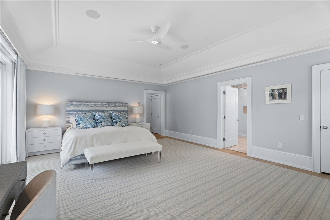 1070 Beach Road, Unit 1070 Vero Beach, FL 32963 - Photo 19 of 36 a bedroom with a bed and wooden floor