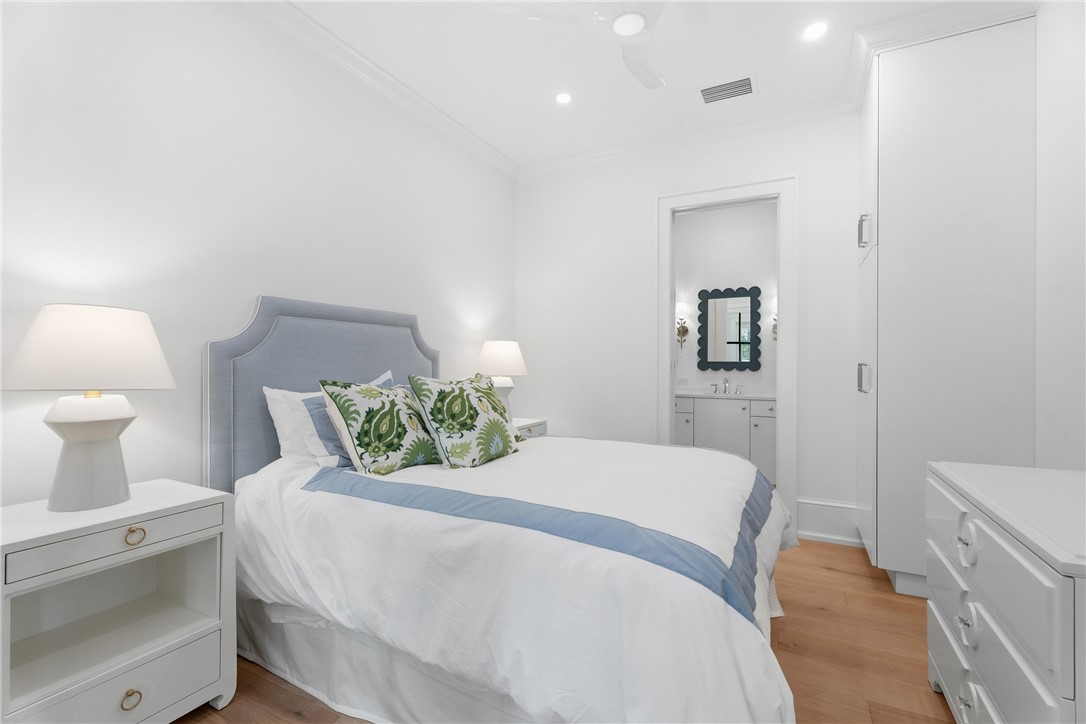 1070 Beach Road, Unit 1070 Vero Beach, FL 32963 - Photo 27 of 36 a bedroom with a bed and a lamp