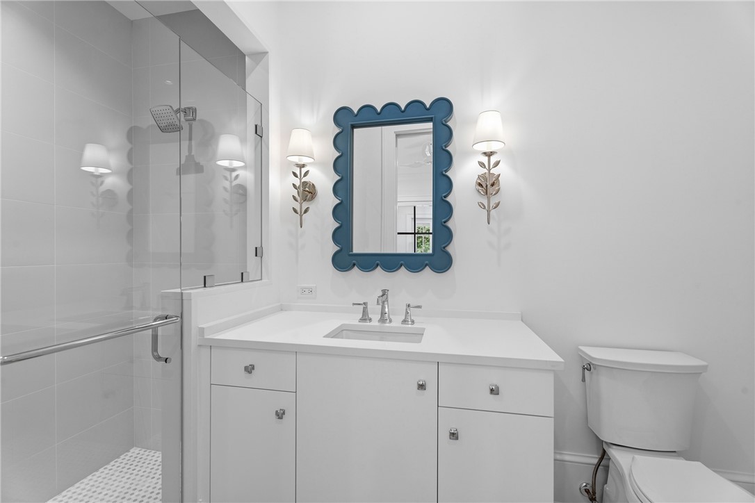 1070 Beach Road, Unit 1070 Vero Beach, FL 32963 - Photo 29 of 36 a bathroom with a sink vanity and toilet