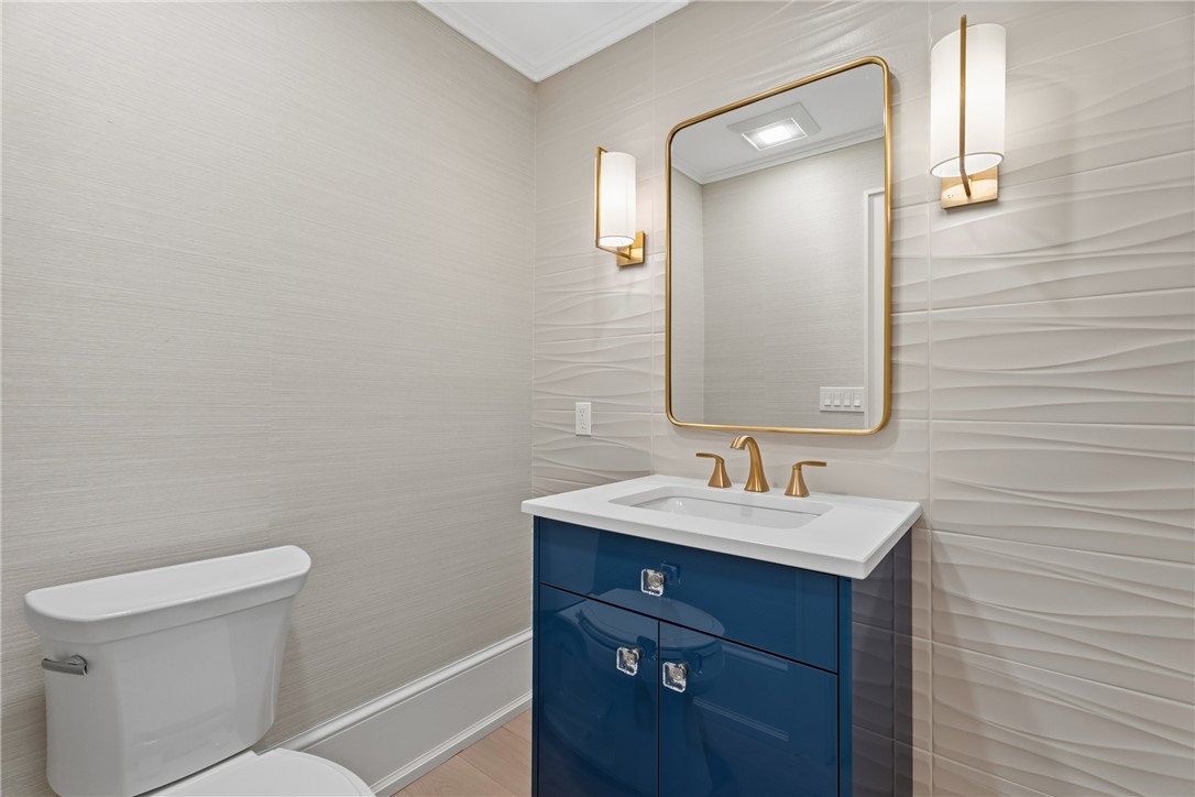1070 Beach Road, Unit 1070 Vero Beach, FL 32963 - Photo 33 of 36 a bathroom with a toilet sink and mirror
