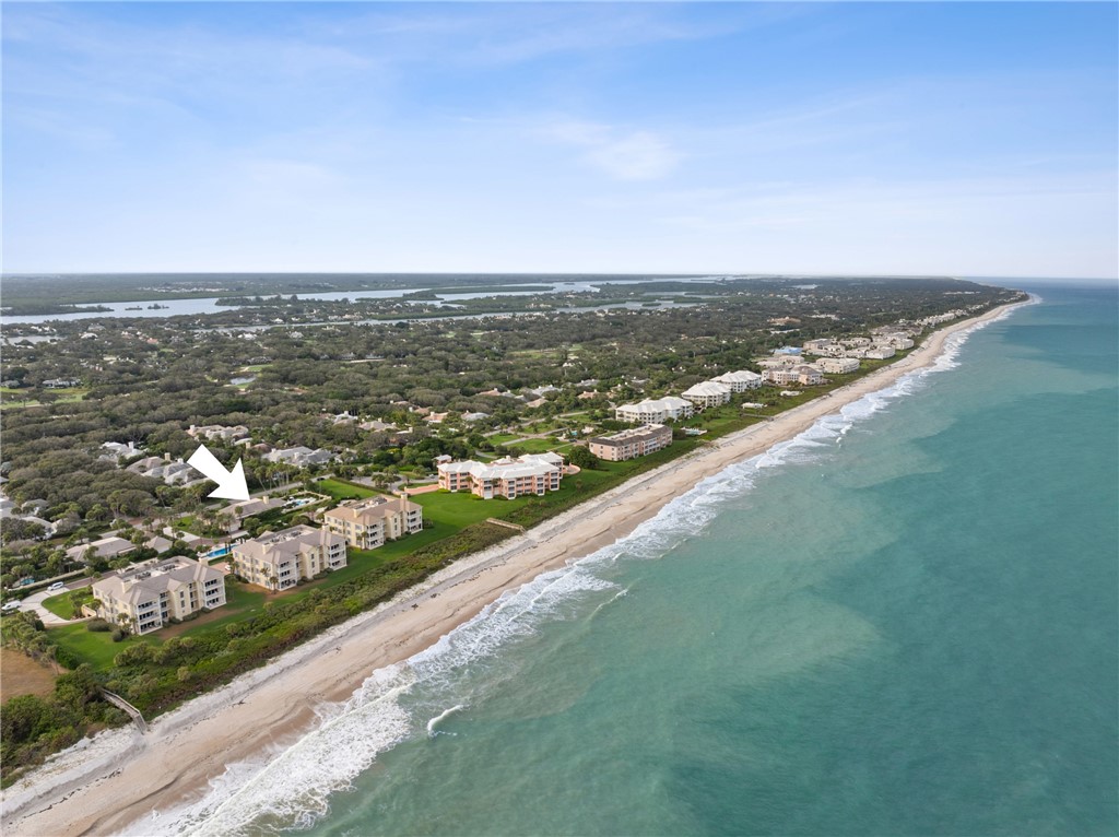 1070 Beach Road, Unit 1070 Vero Beach, FL 32963 - Photo 35 of 36 an aerial view of city and lake