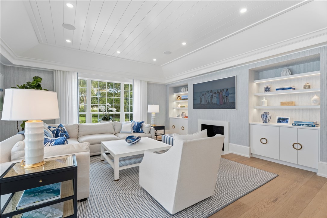 1070 Beach Road, Unit 1070 Vero Beach, FL 32963 - Photo 7 of 36 a living room with furniture a table a lamp and a window