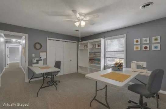 a view of a workspace with furniture