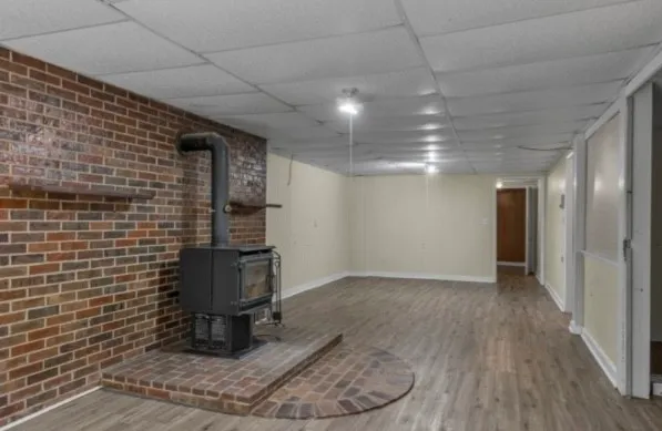 a living room with furniture a fireplace and a table