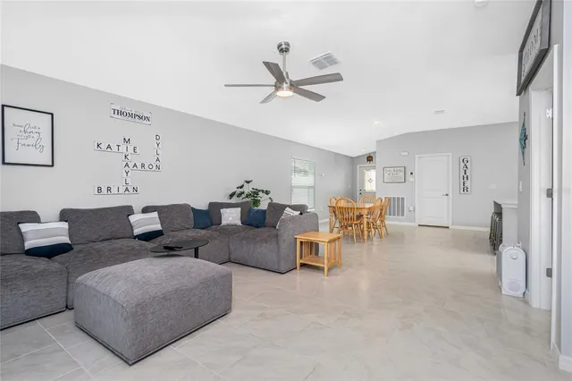a living room with furniture and a table
