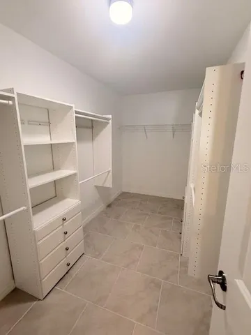 a view of an empty walk in closet