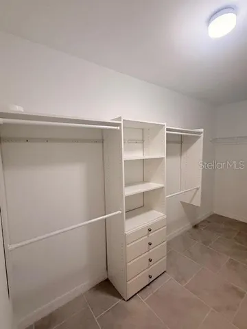 a view of an empty walk in closet