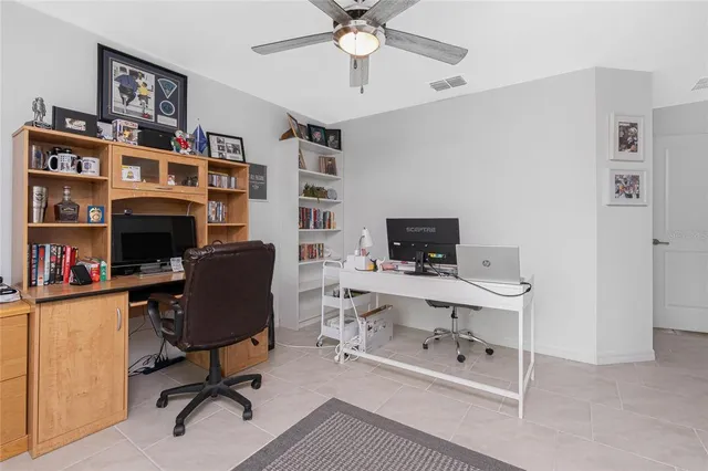 a view of a workspace with furniture and a workspace