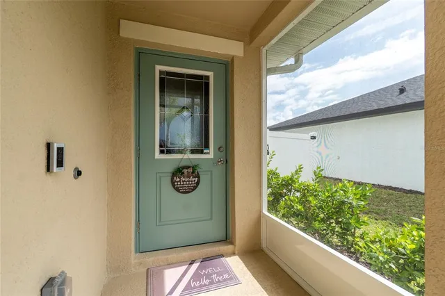 a view of a front door of the house and a street