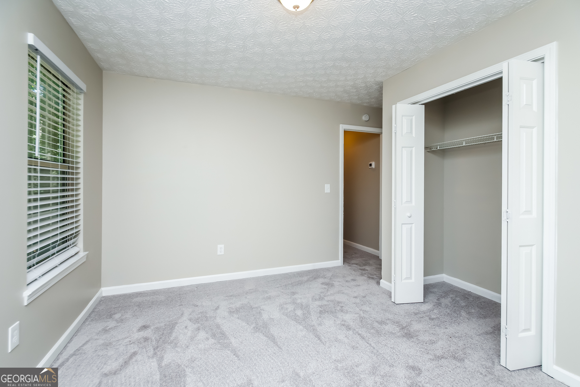 4508 High Grove Court Northwest Acworth, GA 30102 - Photo 12 of 16 a view of an empty room with closet and a window