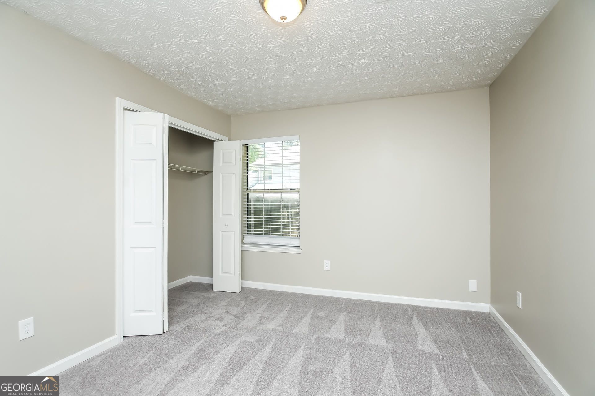 4508 High Grove Court Northwest Acworth, GA 30102 - Photo 13 of 16 an empty room with windows and closet