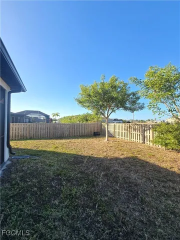 a view of a yard and mountain