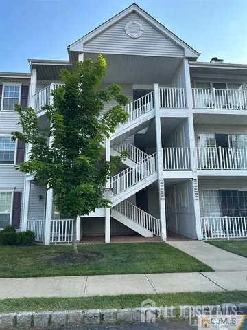a view of a house with a yard and plants