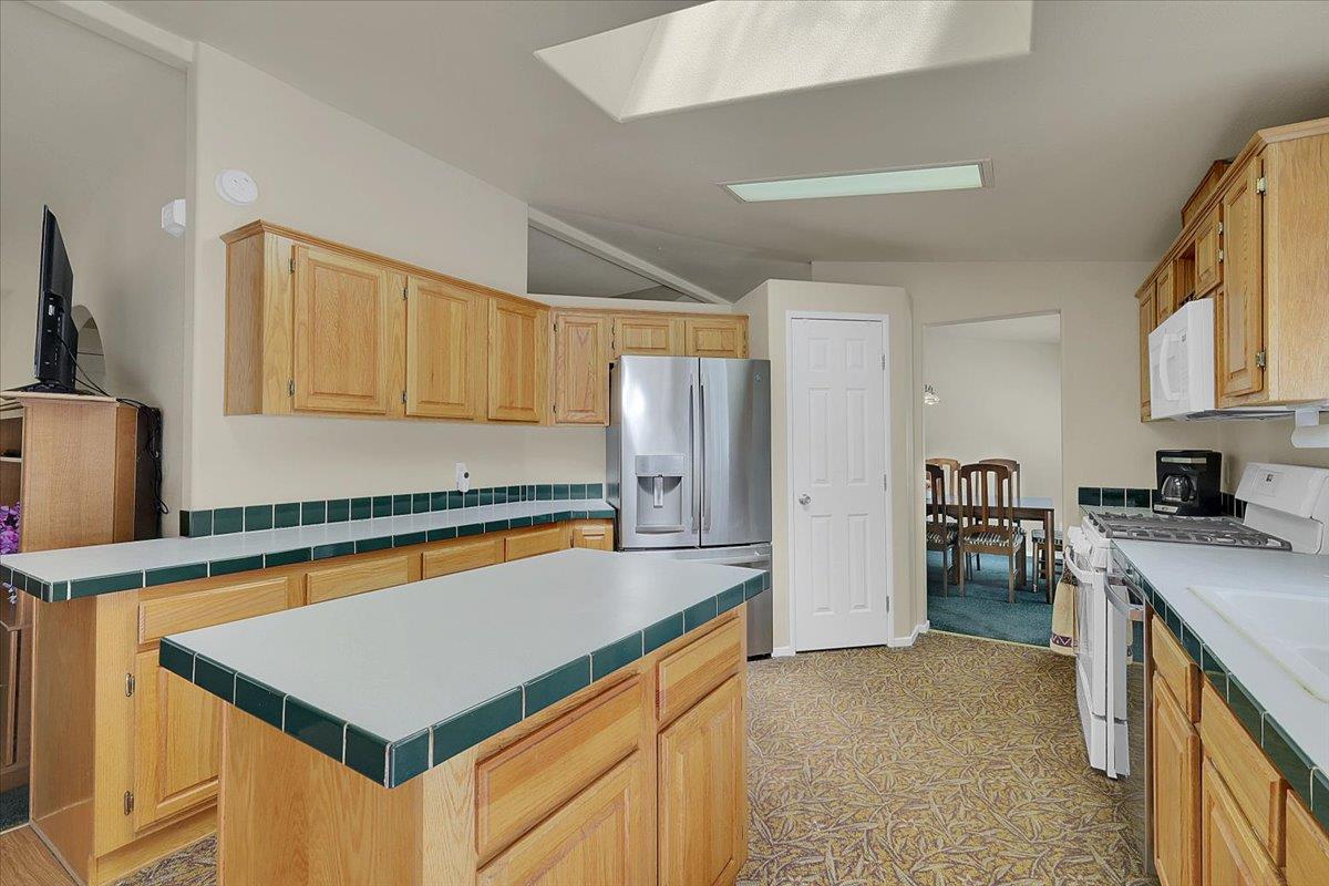 138 Big Fir Road Forbestown, CA 95941 - Photo 22 of 56 a kitchen with stainless steel appliances granite countertop a sink stove and refrigerator