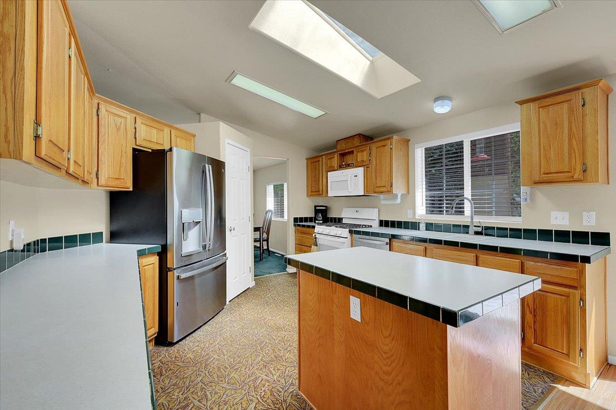 138 Big Fir Road Forbestown, CA 95941 - Photo 23 of 56 a kitchen with stainless steel appliances granite countertop a refrigerator a sink dishwasher a stove and a refrigerator