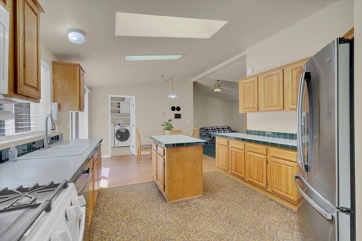 138 Big Fir Road Forbestown, CA 95941 - Photo 25 of 56 a kitchen with stainless steel appliances granite countertop a sink stove and refrigerator