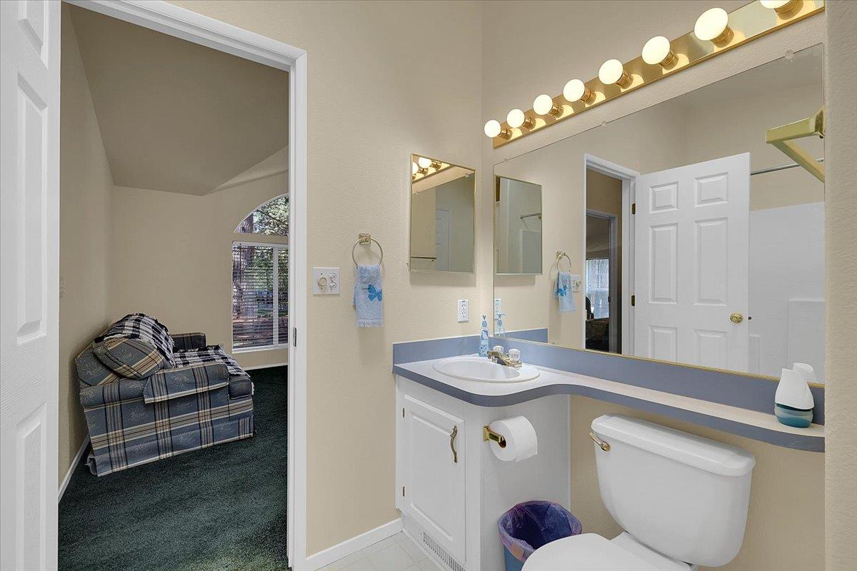 138 Big Fir Road Forbestown, CA 95941 - Photo 27 of 56 a bathroom with a sink vanity granite and a mirror