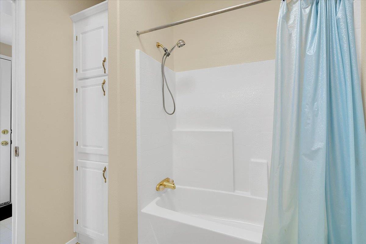 138 Big Fir Road Forbestown, CA 95941 - Photo 28 of 56 a bathroom with a shower and a bath tub