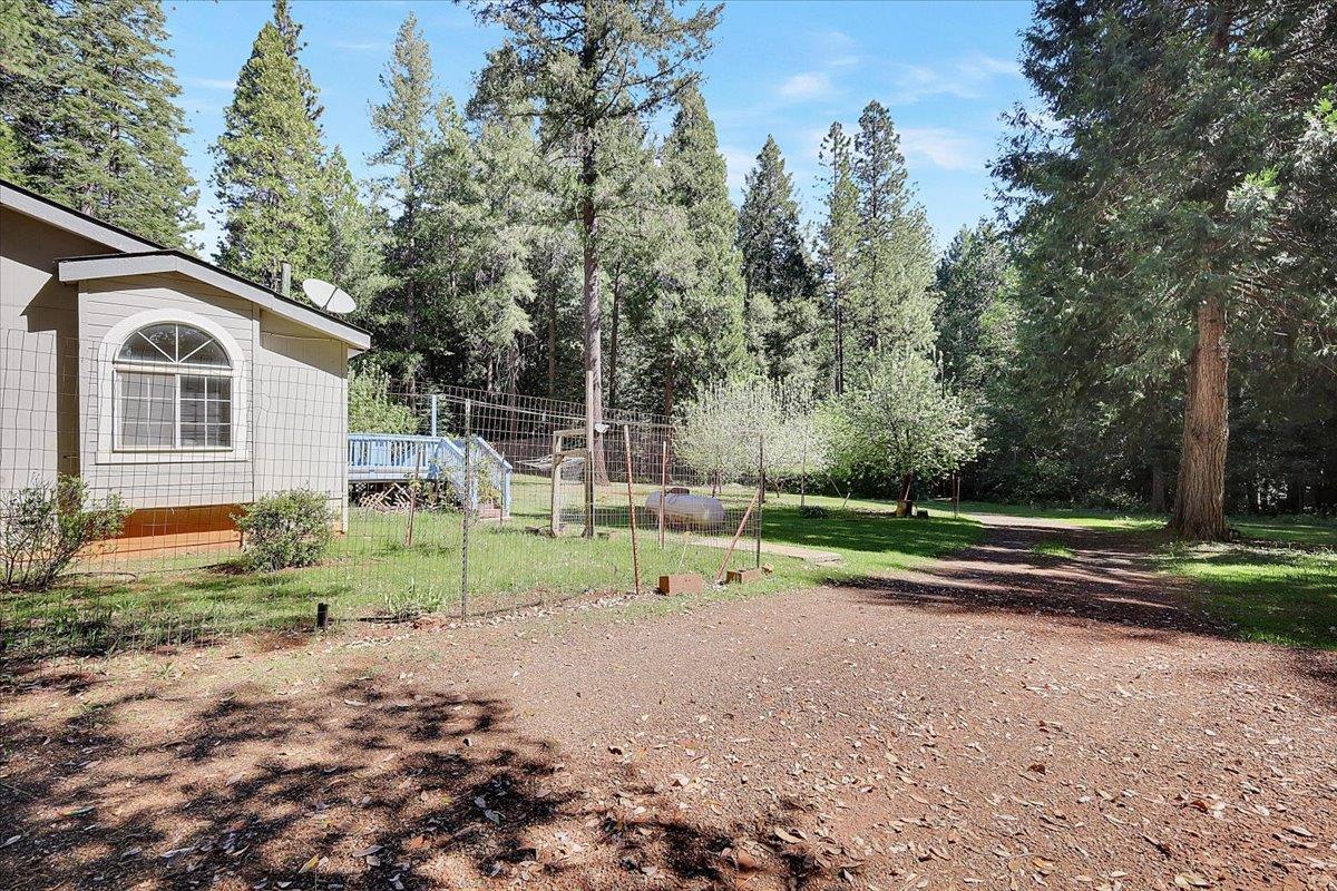 138 Big Fir Road Forbestown, CA 95941 - Photo 41 of 56 a house with green field in front of it