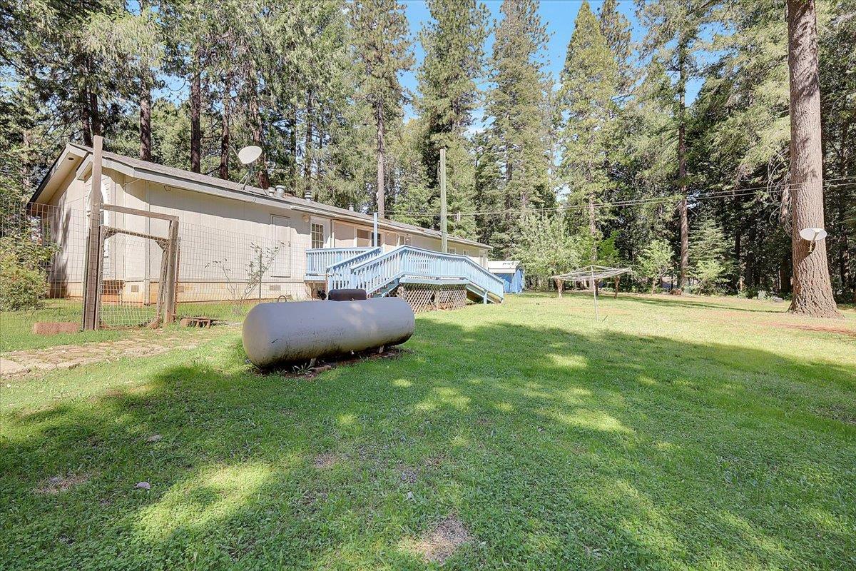 138 Big Fir Road Forbestown, CA 95941 - Photo 43 of 56 a backyard of a house with table and chairs