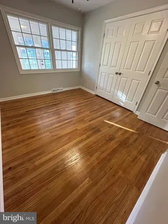 a view of an empty room with windows